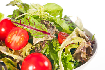 Extreme close up of fresh tomato and lettuce salad