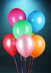 bright balloons on blue background