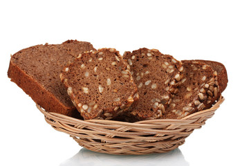 delicious sliced ​​rye bread in  wicker basket isolated on white
