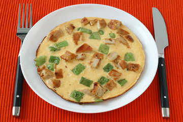 Omelet with meat and vegetables
