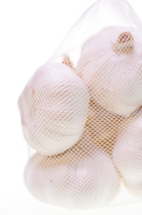 Garlic bulbs in a bag close up
