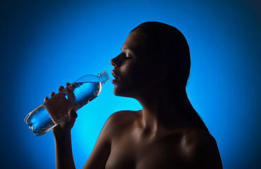 Beautiful woman holding a bottle of water