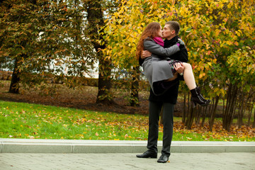 young man holding woman