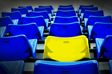 A yellow vip seat in football stadium