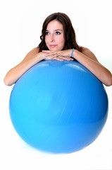 Fitness woman exercising on a ball