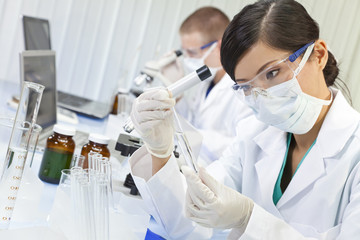 Chinese Female Woman Scientist With Test Tube In Laboratory