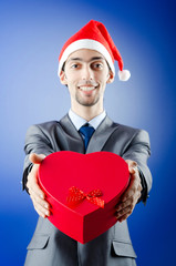 Businessman offering gifts on christmas