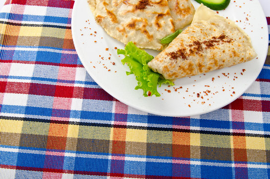 Herb stuffed pancaces in the plate