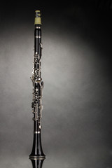 beautiful clarinet on a gray background - obrazy, fototapety, plakaty