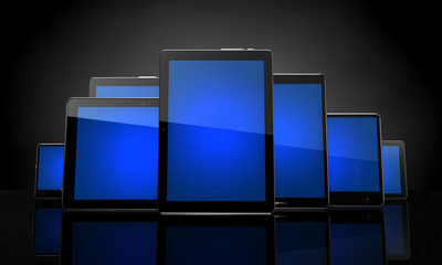 Digital pads with blue touchscreens on black