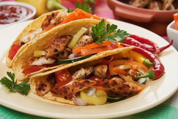 Grilled chicken meat in taco shells