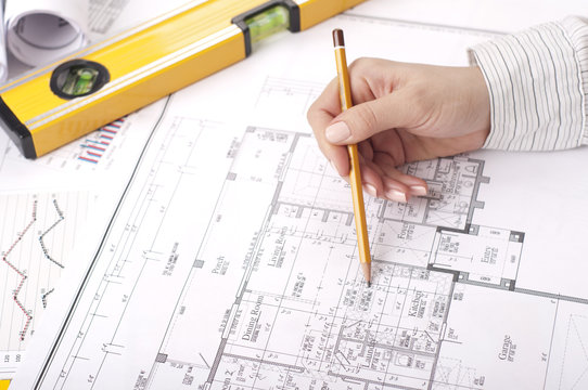 female hand specifies the drawing