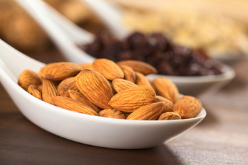 Almonds on ceramic spoon