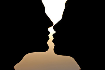Young Couple Silhouette at Sunset