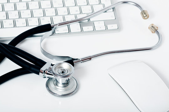 medical stethoscope, keyboard and mouse