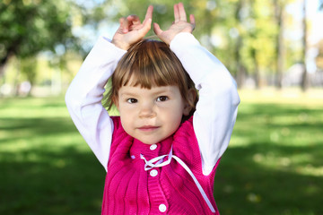Little girl in summer park