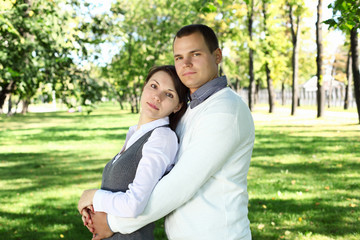 Fototapeta premium Young family with a child in summer park