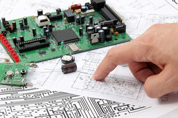 Electronic circuit boards on the background of electronic scheme