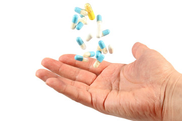 A hand with  pills