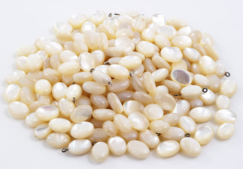 Pile of mother of pearl beads.