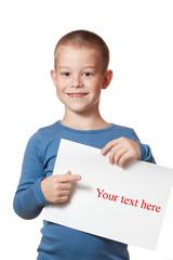 smiling boy holding blank sheet of paper