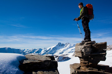 Young man in the mountains enjoying the view
