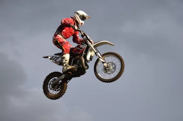 Foto op Aluminium The spectacular jump racer on a motorcycle © VVKSAM
