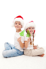 Christmas kids with candy on stick