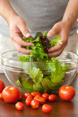 man preparing salad