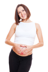 pregnant woman showing fingers like heart