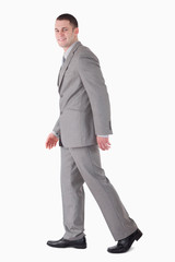 Portrait of a smiling businessman walking
