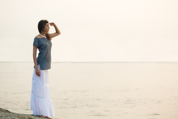 Fototapeta na wymiar woman standing on coast