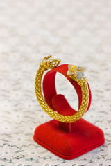 jewely pattern on golden bangle