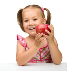 Portrait of a little girl with apple