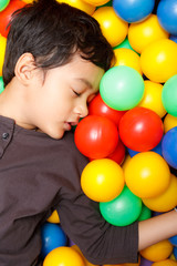 Fototapeta na wymiar Asian boy and colorful small ball