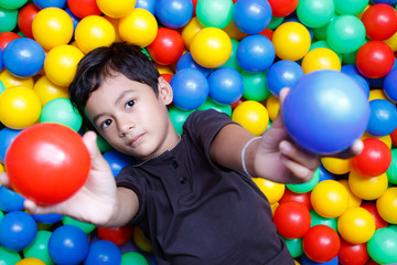 Asian boy and colorful small ball