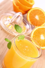 Orange juice freshly squeezed from fresh fruits with a juicer