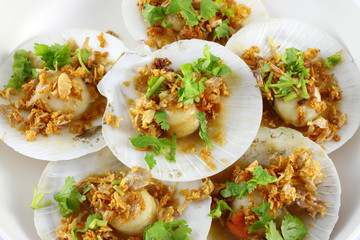 Shell sea food in fried garlic and parsley.