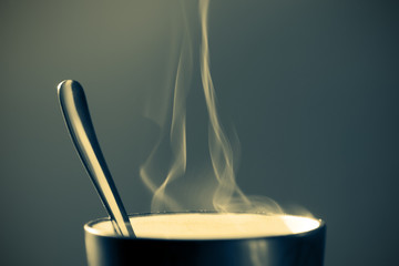 Close up image of a mug containing hot beverage