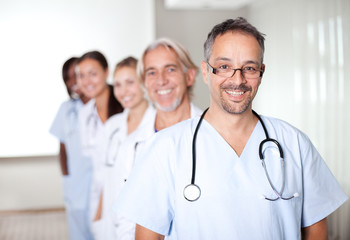 Fototapeta premium Portrait of a mature male doctor standing