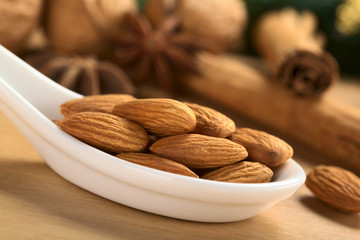 Almonds on ceramic spoon
