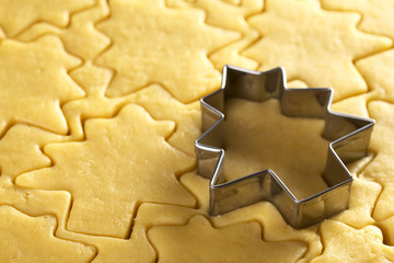 Cutting out Christmas cookies from shortcrust dough
