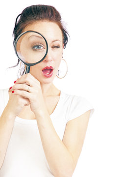 Pretty Young Woman With Magnifying Glass