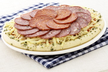 raw salami and pepperoni pizza