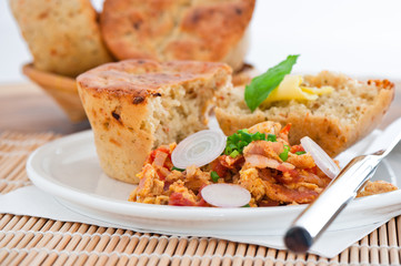 Homemade mediterranean bread with butter scrambled eggs and a le