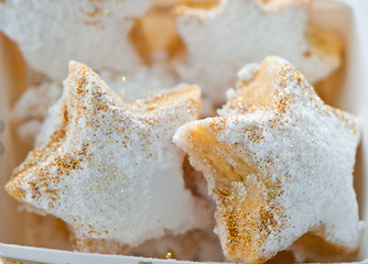 Christmas cookies in a box with gold stars