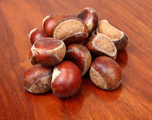 chestnuts on wooden background