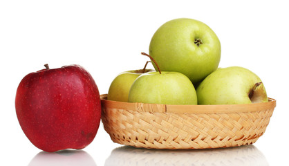 juicy green apples in the basket and red apple isolated on white