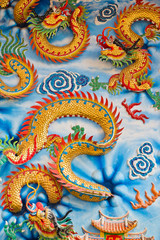 Statue of a dragon on the wall.