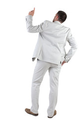 Back view of  thinking young business man in  white suit.
